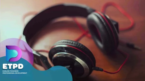 The pictures shows a pair of headphones with a red wire on a wooden table with logo of ETPD