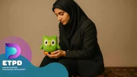A veiled female professor looking at the Duolingo doll; a promotional image related to ETPD, English Teachers' Professional Development.